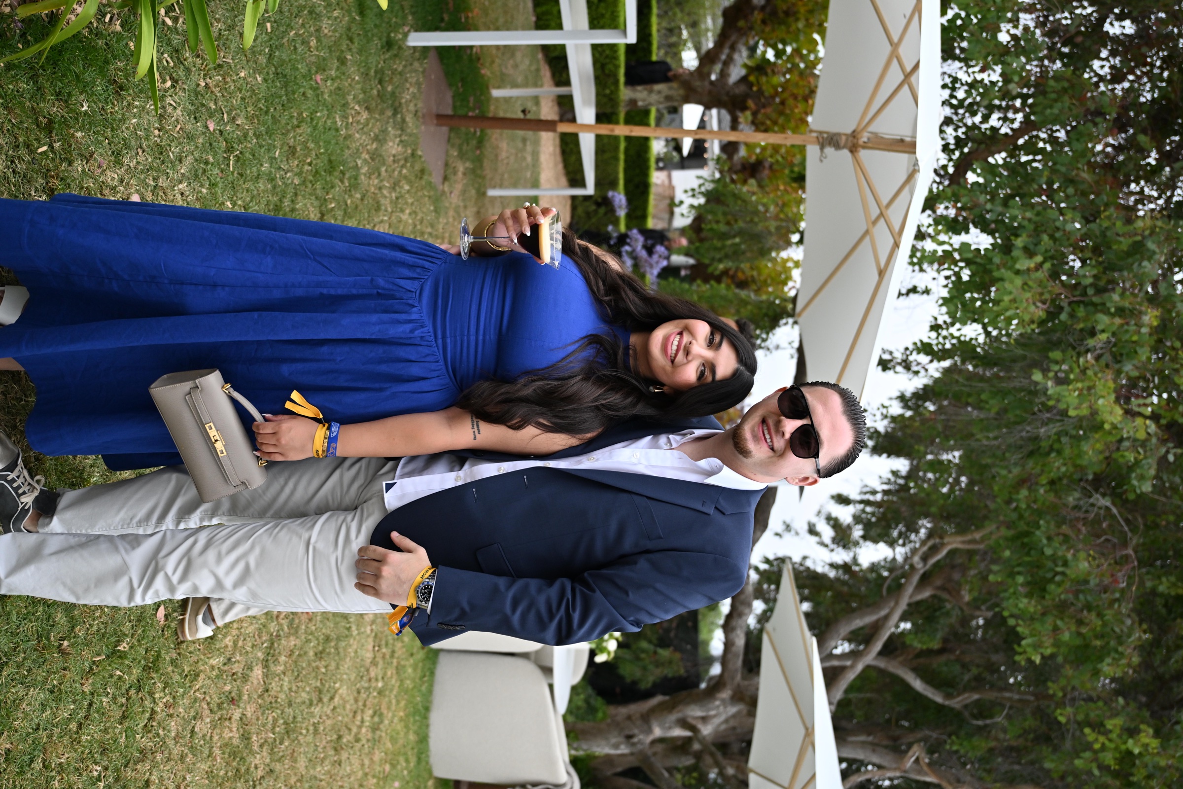 2 guests posing on the garden lawn at Lamborghini Villa during Monterey Car Week 2026