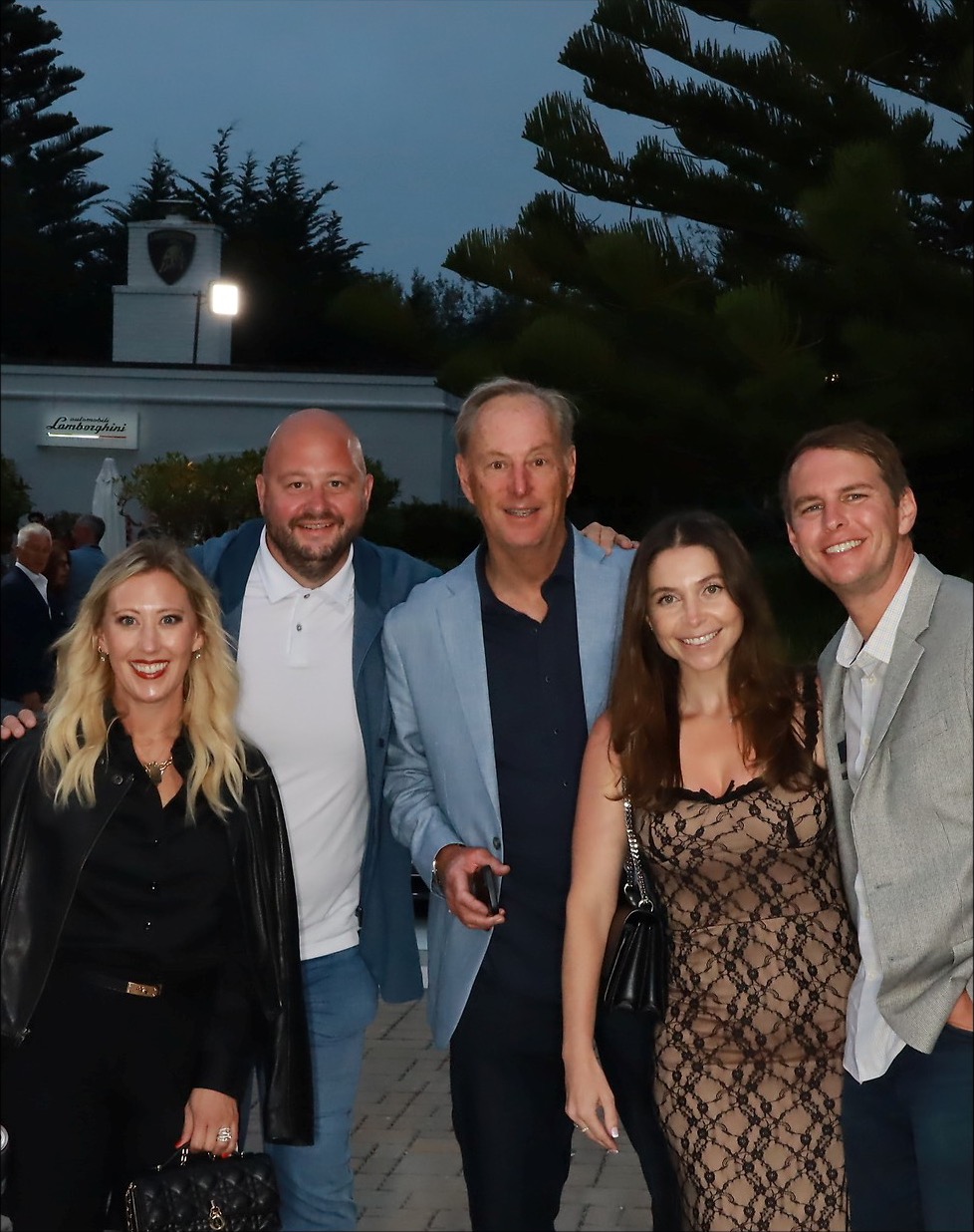 Guests posing together at Lamborghini Luxury Experience