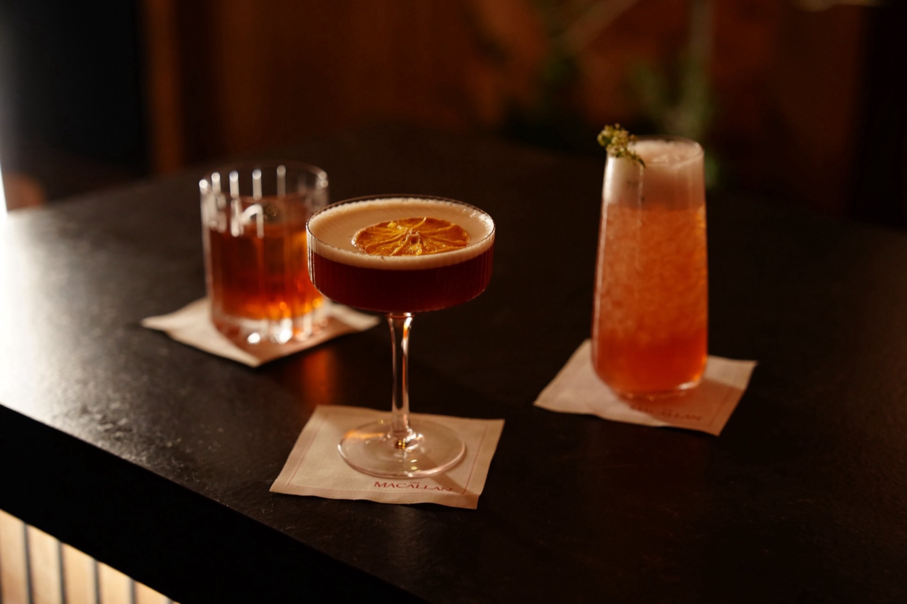 Three cocktails on The Macallan branded coasters