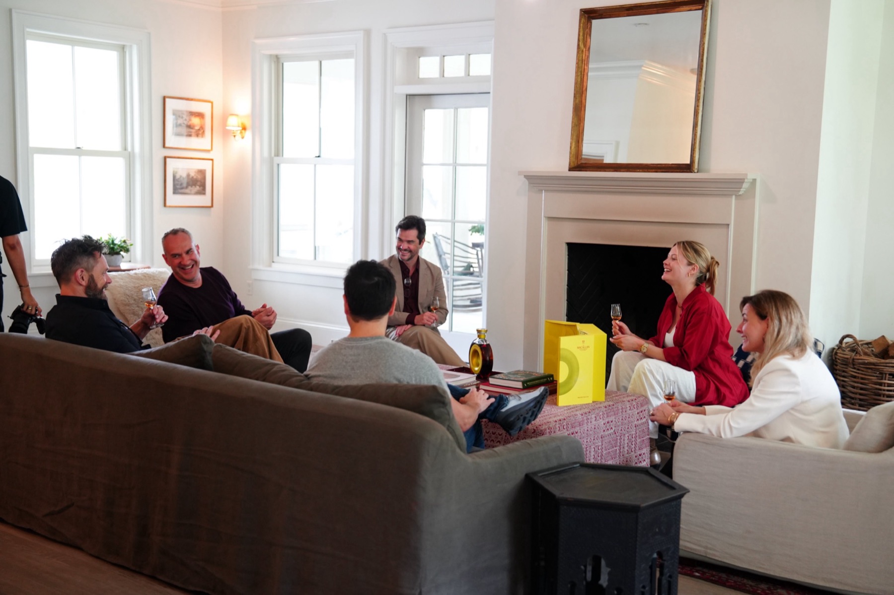 Guests sharing a tasting of The Macallan in the INNESS farmhouse lounge