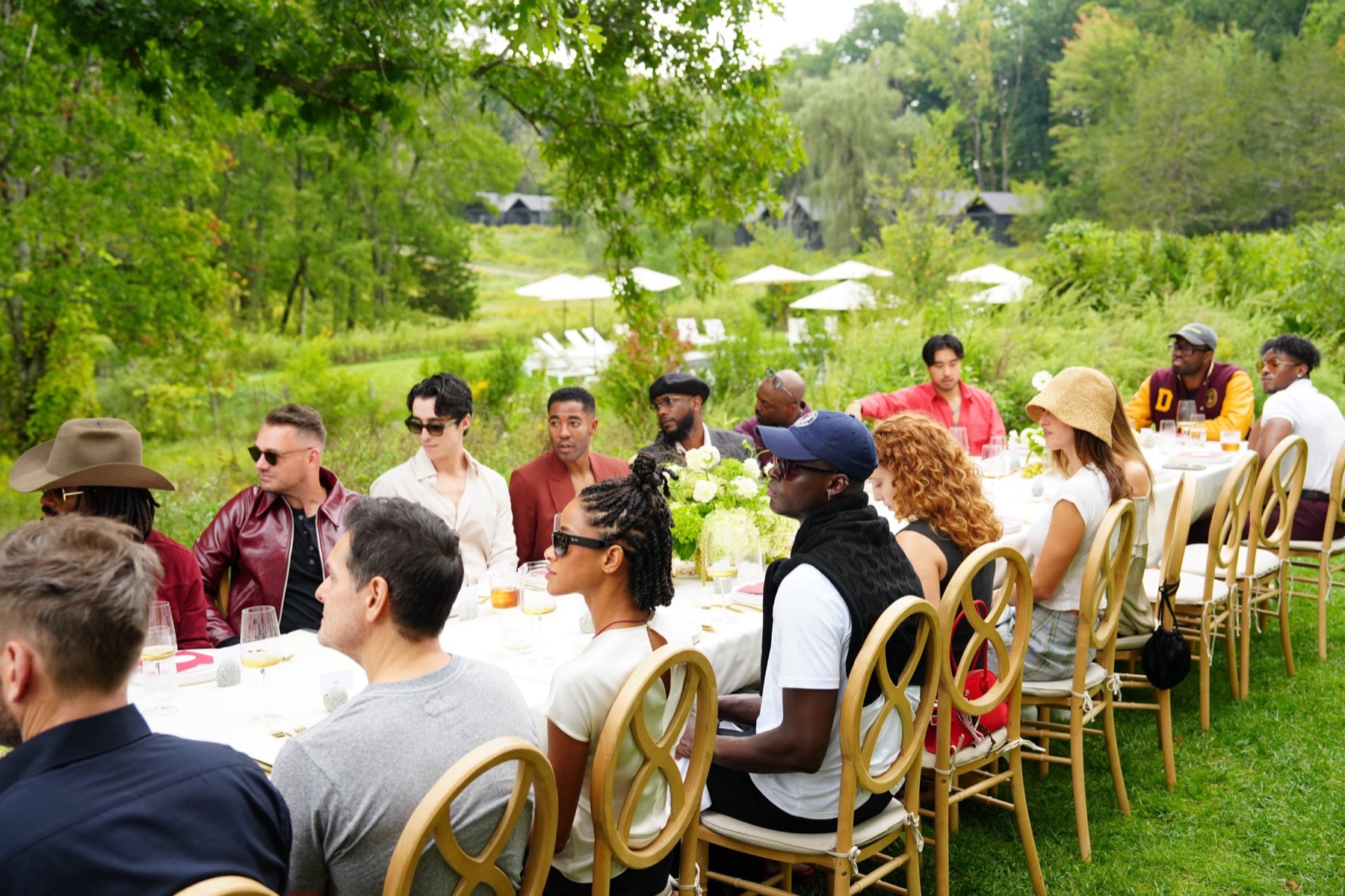 Guests at a long outdoor lunch table at INNESS