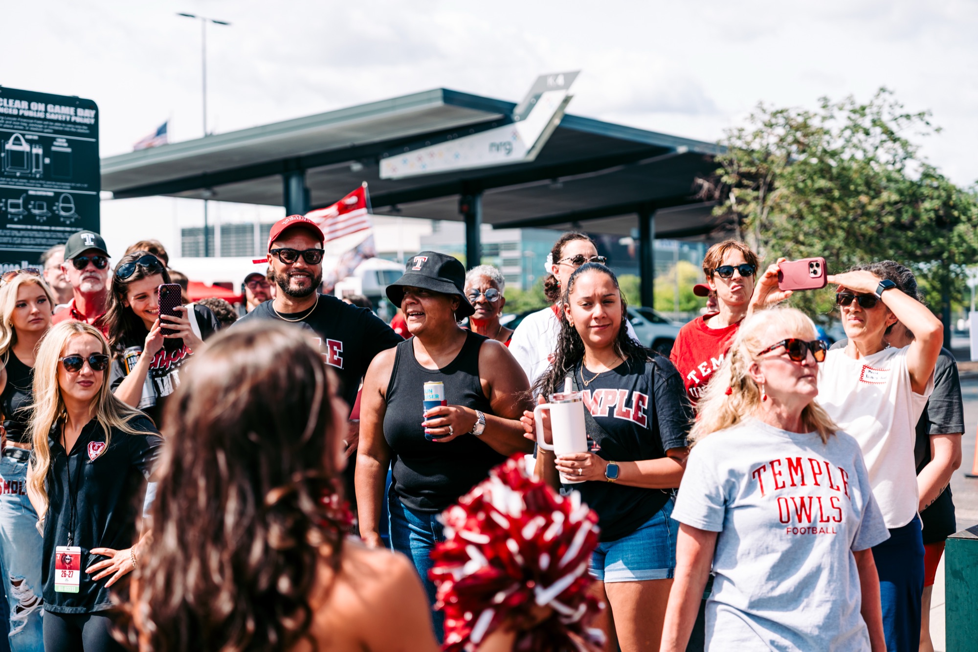 Temple fans watching the cheer squad in the lot