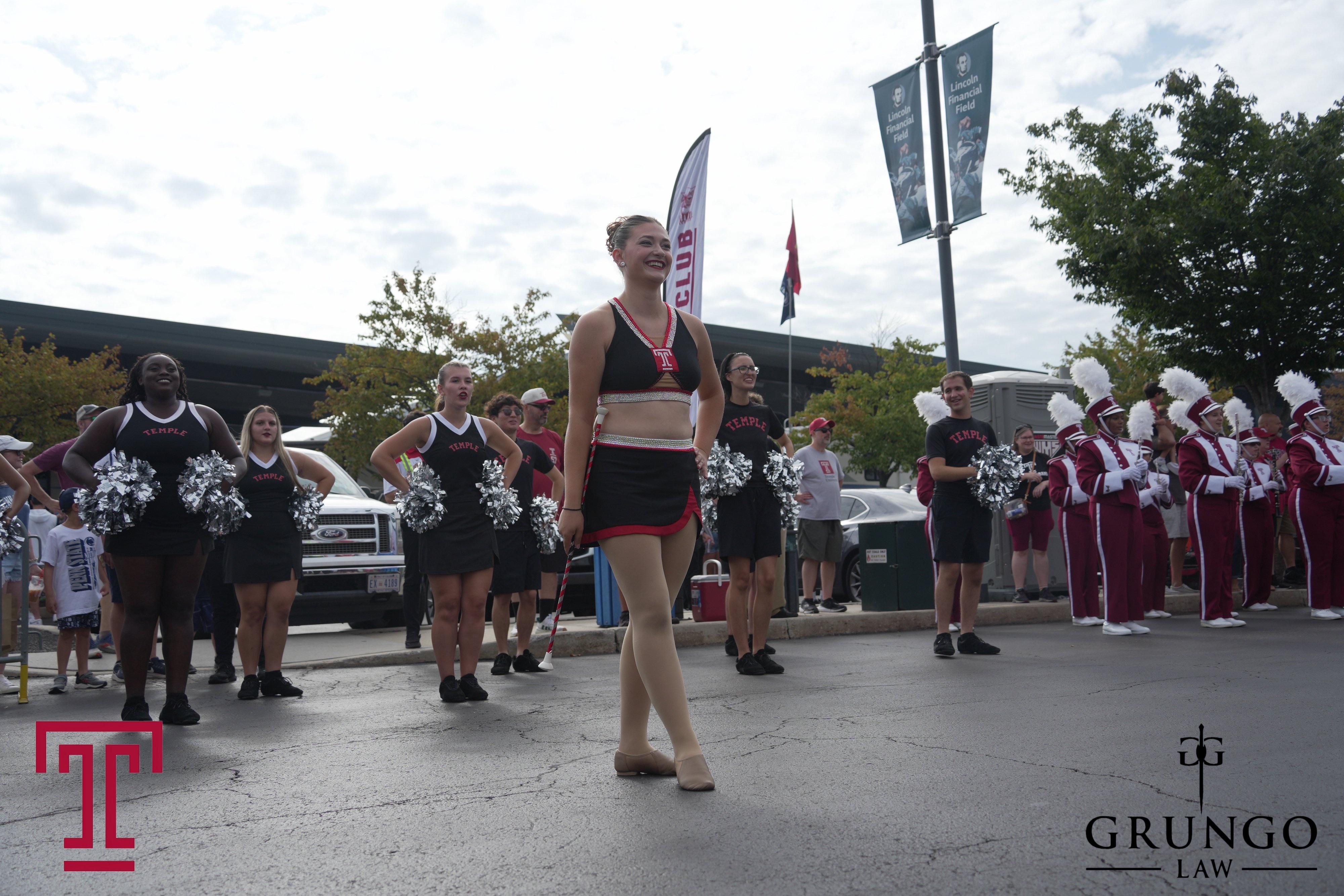 Temple band and cheerleaders with a different Grungo Law watermark treatment