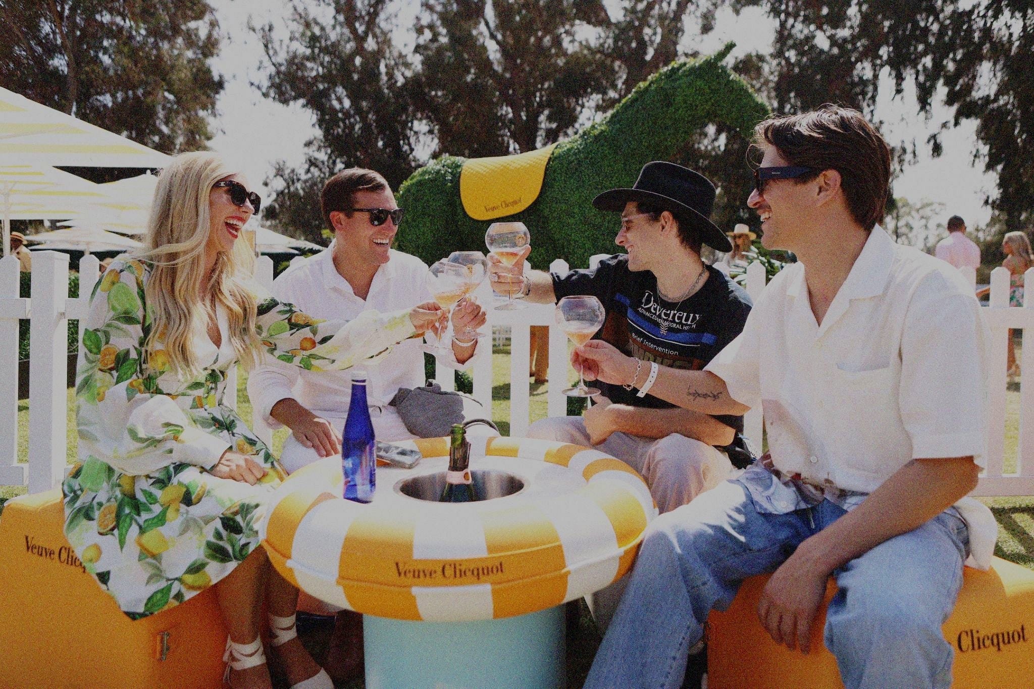 Veuve Clicquot Polo Classic guests raising champagne glasses