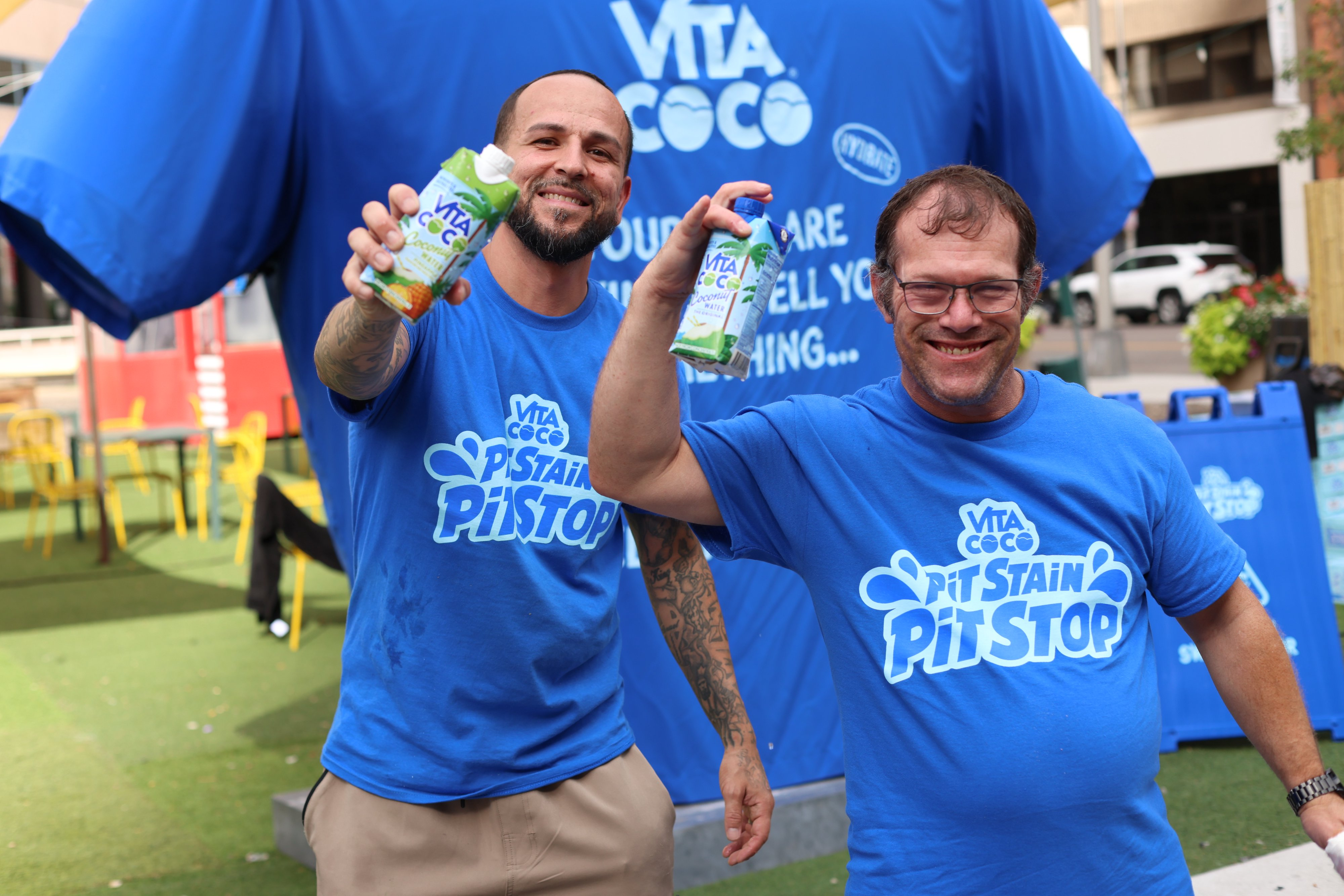 Guests holding Vita Coco samples at the tour stop
