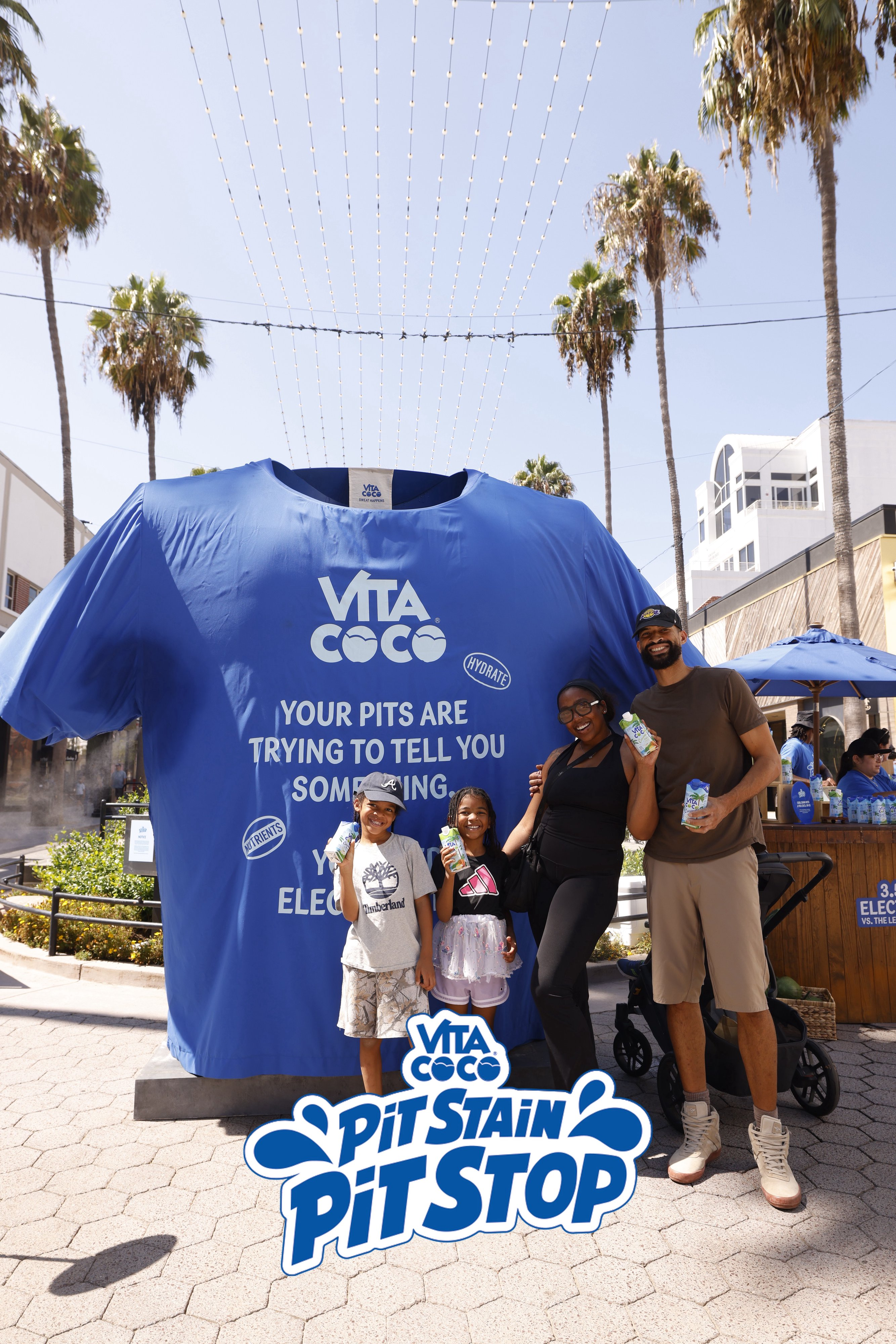 Family posing at the Vita Coco Pit Stain Pit Stop